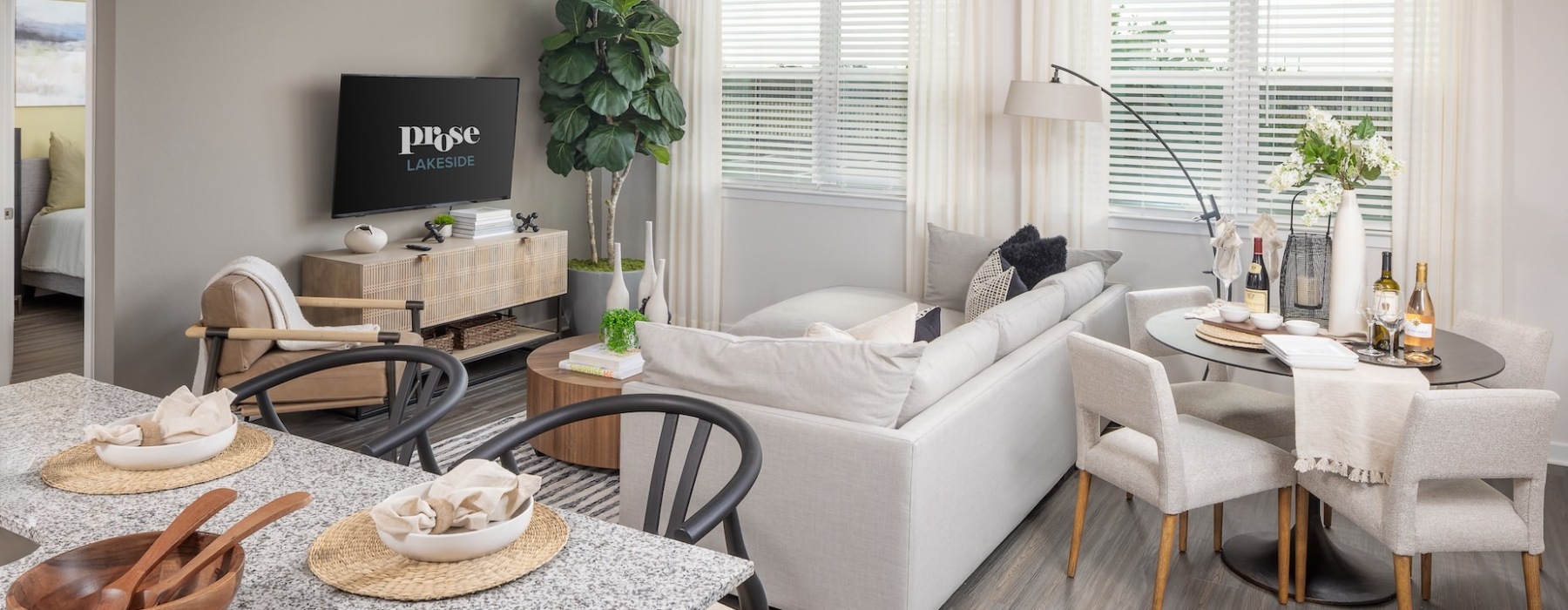 living room with seating tables and tv