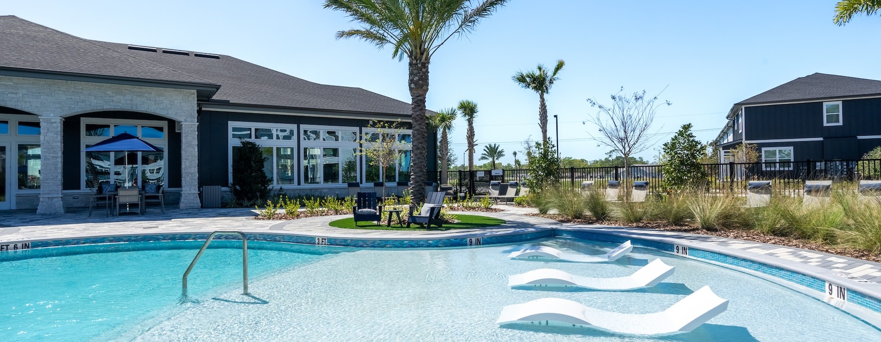 a swimming pool with chairs