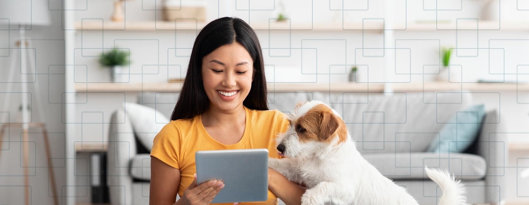 a woman sitting on the floor with a dog